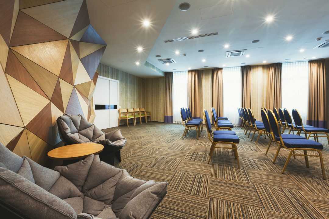 ABOUT US 7 modern hotel lobby with abstract wooden wall